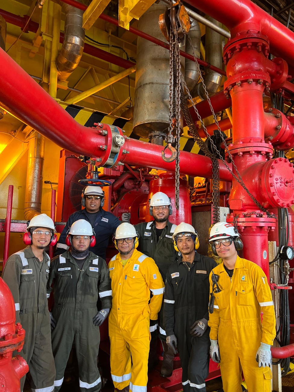 A BWTMS crew on site, in coveralls and hard hats